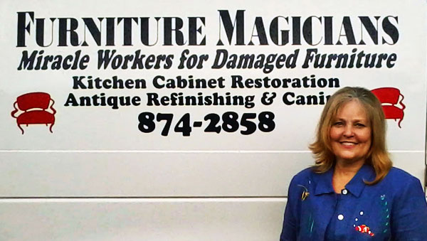 Susan Price, the owner of Furniture Magicians standing in front of our work van